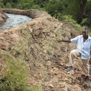 Marakwet team leader Timothy Kipkeu next to irrigation channel